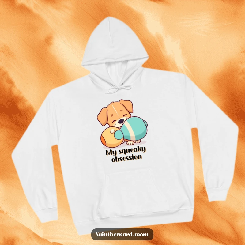 Funny Hoodie: A dog with a floppy ear is playfully interacting with a giant squeaky toy, full of playful intent.