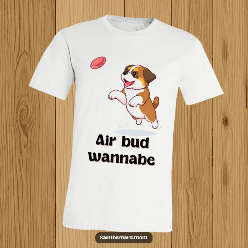 Funny Saint Bernard puppy t-shirt showing a dog jumping high with excitement to catch a frisbee in outdoor play.